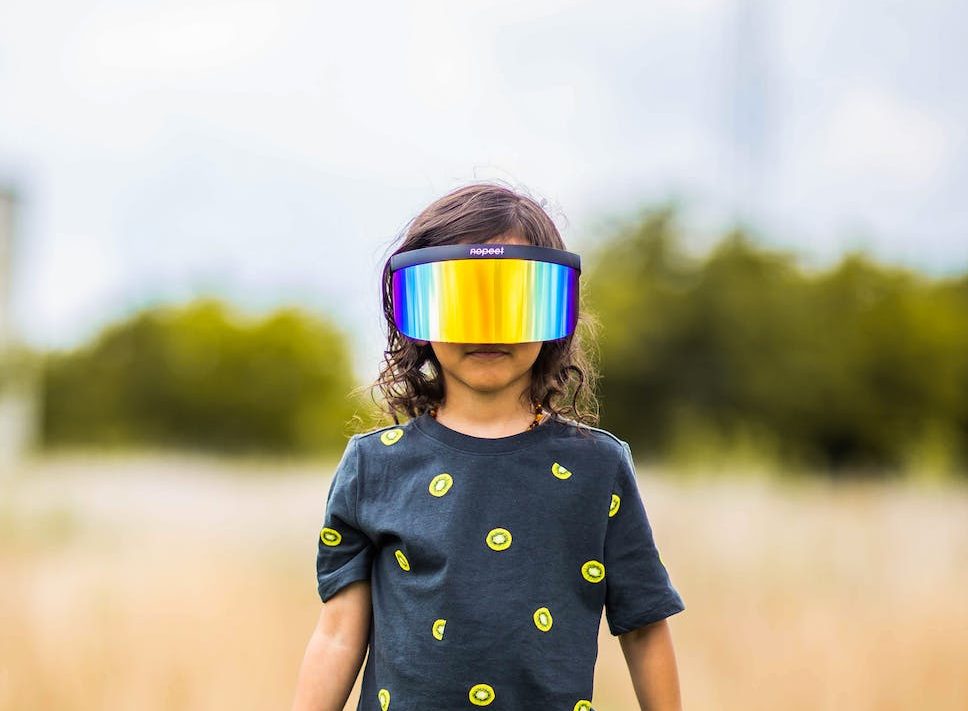 child in polarized mask in countryside
